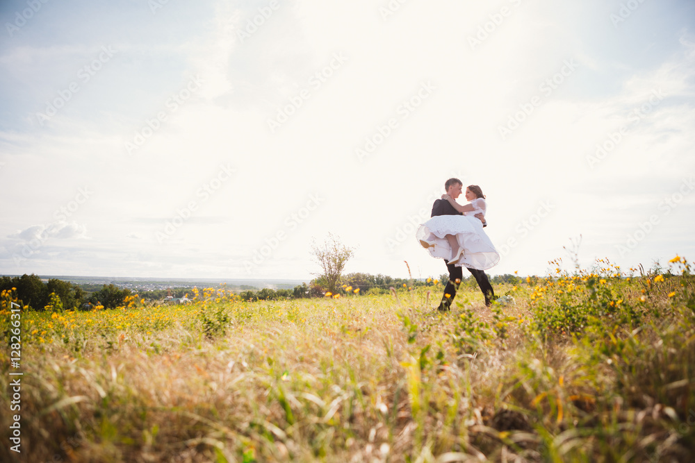 couple bride and groom on field background couple bride and groom on field background