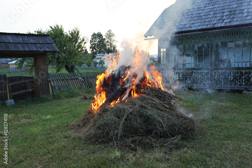 Hay grass burning in peaceful village