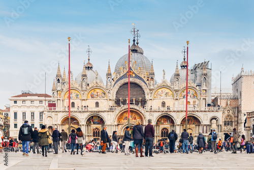 Tourists in Piazza San Marco in front of the basilica, Venice, Italy