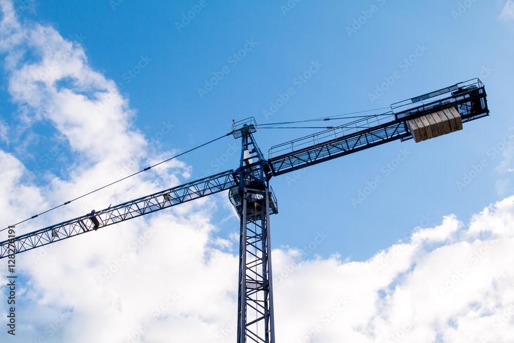 Construction site with cranes on sky background Construction site with cranes on sky background