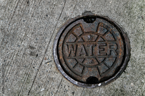Water supply manhole cover.  Access point to water main.