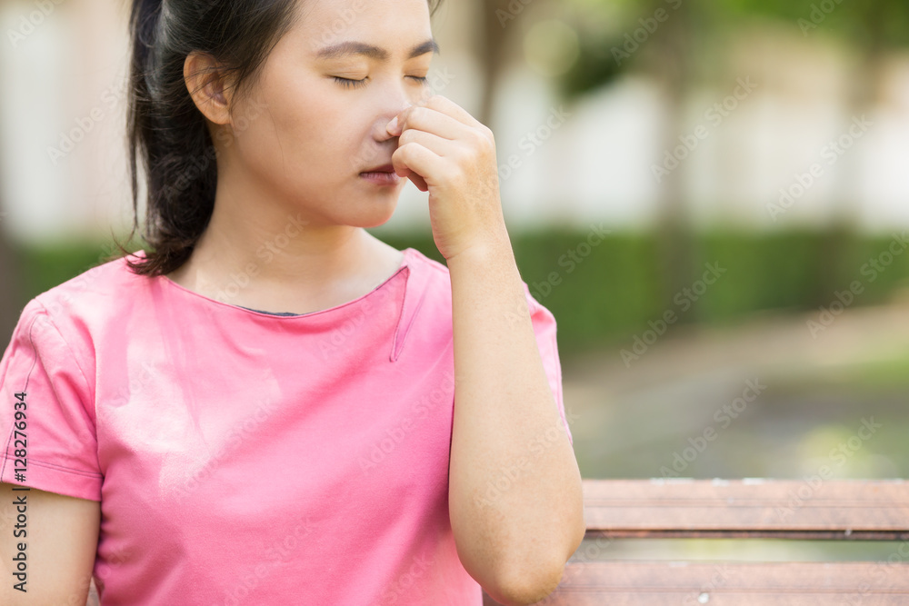 Woman has sneezing at garden Woman has sneezing at garden