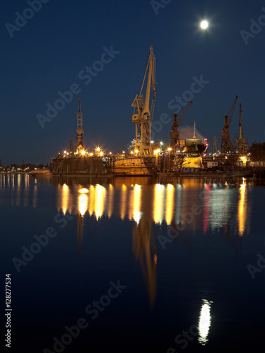 Dry dock in the moonlight at the shipyard in Gdansk, Poland.