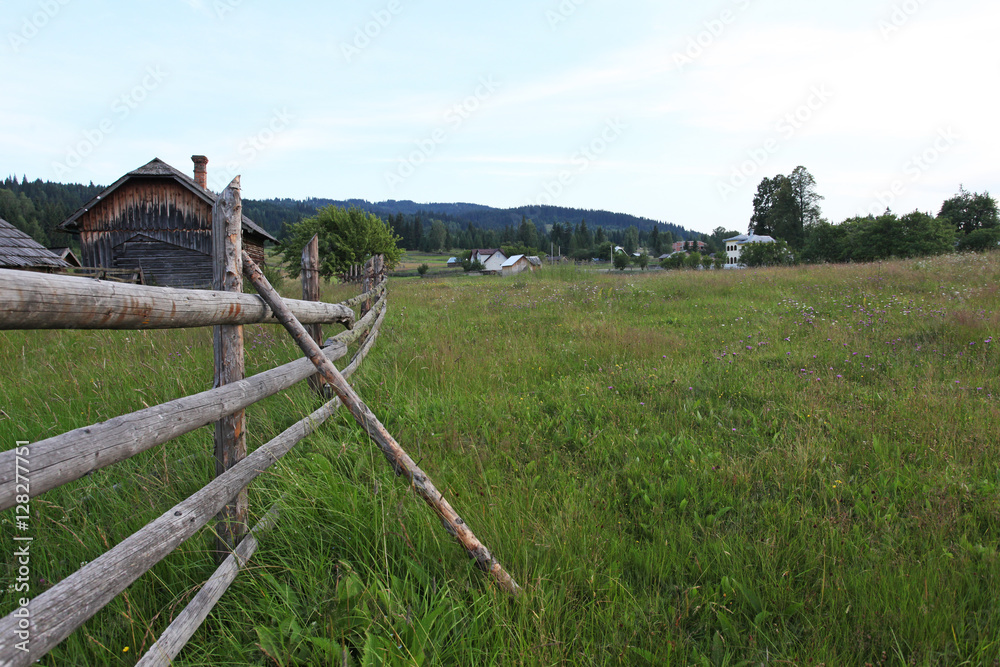 Countryside wood fence meadow in Bucovina, Romania