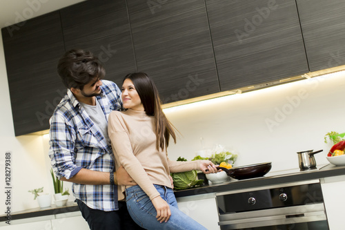 Young couple preparing meal