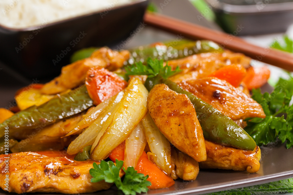 Chicken and Rice with Spicy Sesame Teriyaki Wok Sauce. Selective focus. Chicken and Rice with Spicy Sesame Teriyaki Wok Sauce. Selective focus.