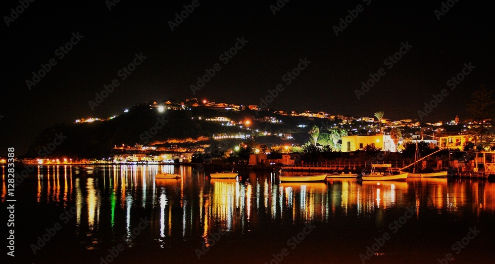 
The lake of Miseno at night with suggestive reflections of light , Bacoli, Naples, Italy 