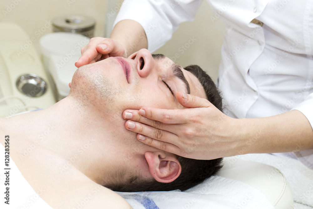 Man in the mask cosmetic procedure in spa salon Man in the mask cosmetic procedure in spa salon