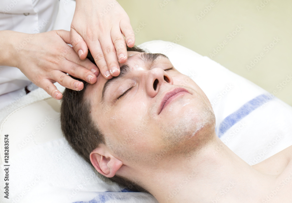 Man in the mask cosmetic procedure in spa salon Man in the mask cosmetic procedure in spa salon