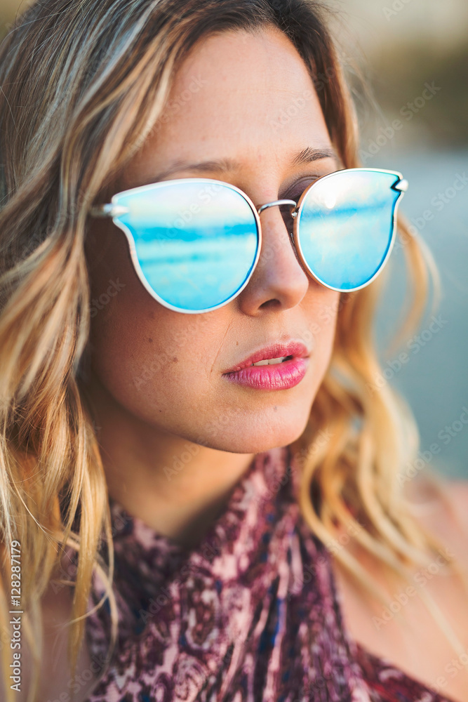 Woman in Sunglasses at the Beach Woman in Sunglasses at the Beach