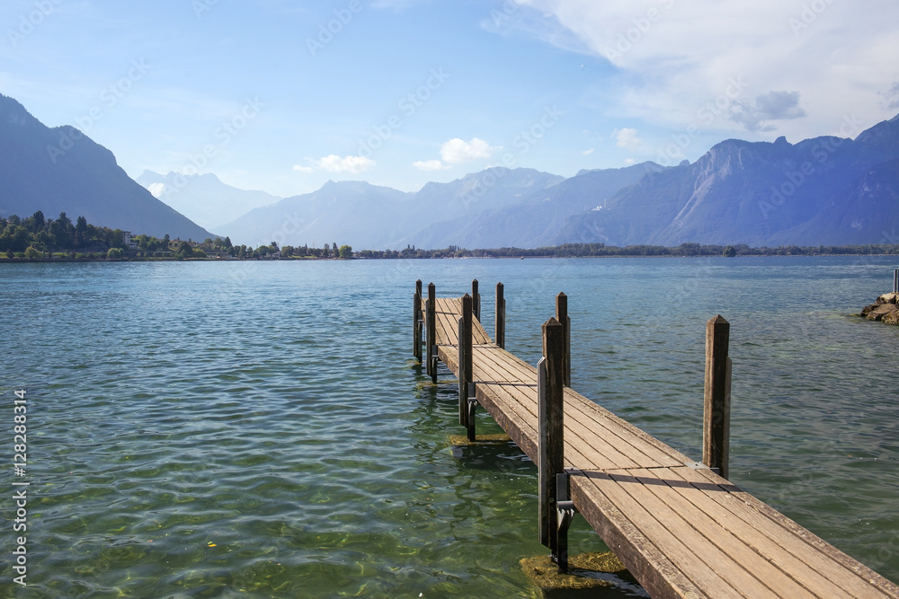 wooden pier overlooking the Swiss Alps and Lake Geneva