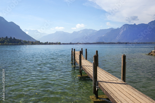 wooden pier overlooking the Swiss Alps and Lake Geneva © irisphoto1