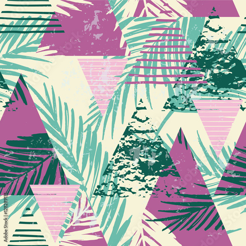 Seamless exotic pattern with palm leaves on geometric background