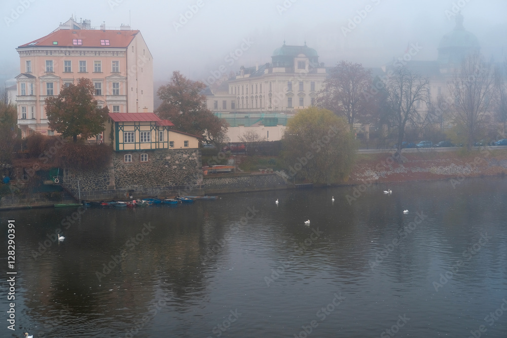 Fototapeta premium Prague, Czechia - November, 21, 2016: morning fog on Vltava river in Prague, Czechia.