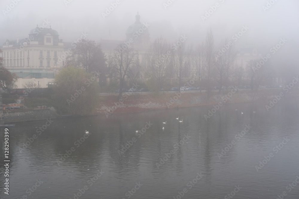 Prague, Czechia - November, 21, 2016: morning fog on Vltava river in Prague, Czechia.
