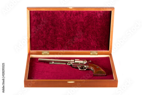 Revolver in gift box on white background