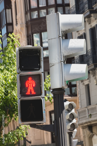 Traffic light shows red light for pedestrians in spain
