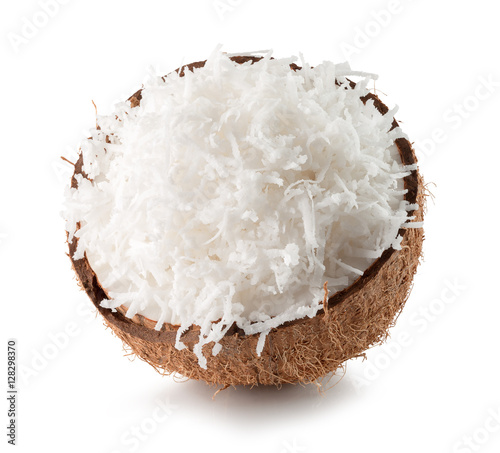 half of coconut with coconut flakes isolated on the white backgr