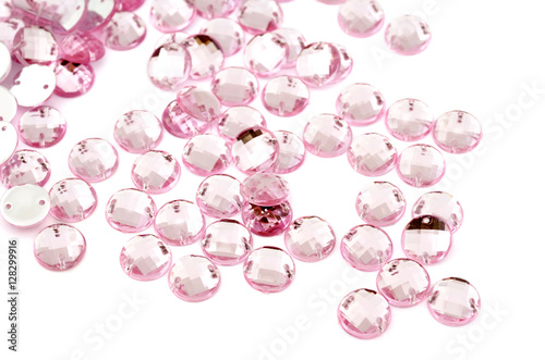 Pink rhinestone on white background