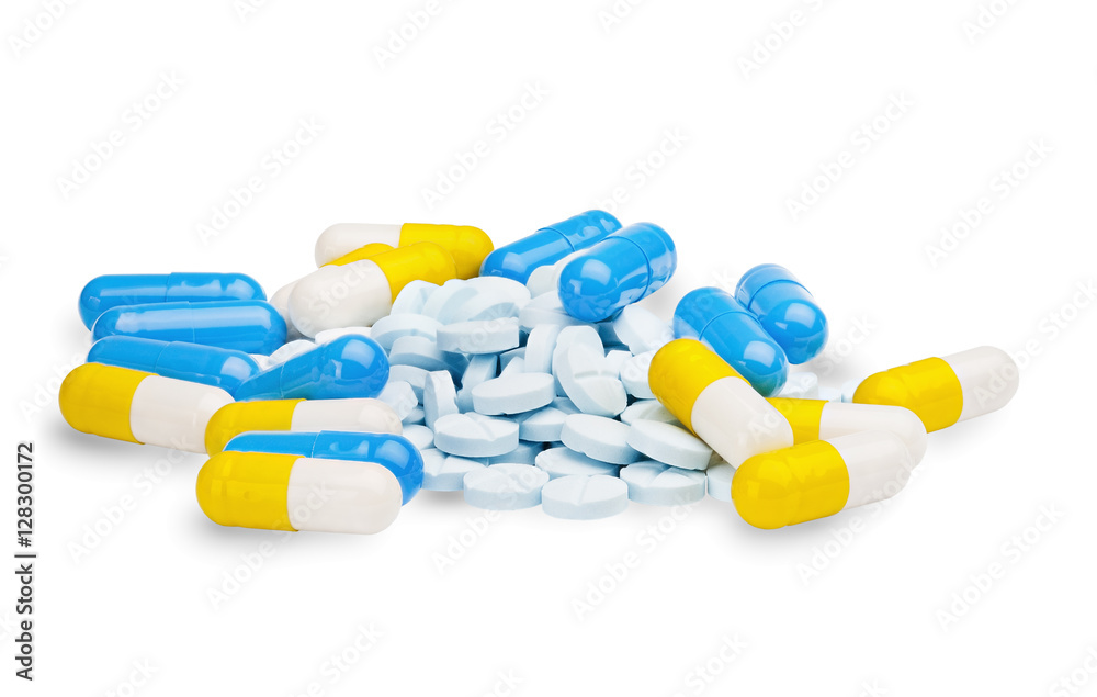 pills blue, yellow and light blue tablets on  isolated white bac