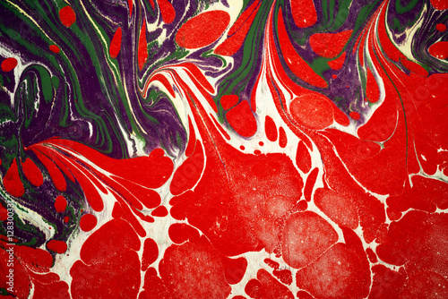 Ebru art. Traditional Turkish Ebru technique. Painting on water, followed by paper prints. Color paint ebru with waves and tile pattern.