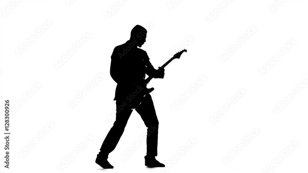 Silhouette of guitarist playing viewer. Electric bass guitar Silhouette of guitarist playing viewer. Electric bass guitar