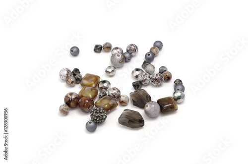 Decorative colorful beads scattered on white background - accessories for handmade and hobby