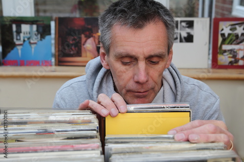Record collector looking through vinyl 7