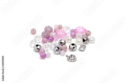 Decorative colorful beads scattered on white background - accessories for handmade and hobby