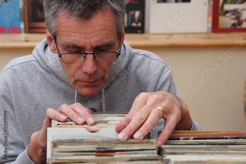 Record collector looking through vinyl 7