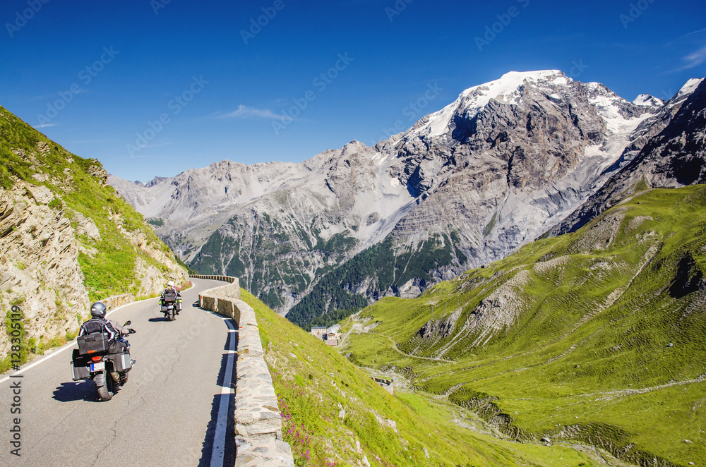 Naklejka premium Close view on motorbike on the famous road in mountains Alps Passo Stelvio. Favourite place for all bike riders