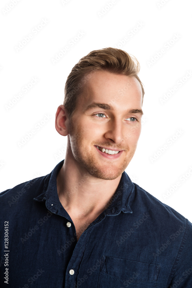 Attractive man standing against a white background wearing a blue shirt, smiling. Attractive man standing against a white background wearing a blue shirt, smiling.