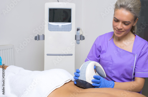 beauty treatment of a young woman in specialized clinic