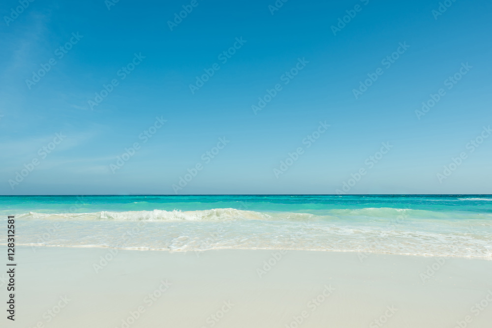 Beautiful gentle wave at the tropical beach with blue sky