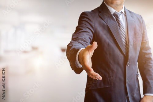 Fotografi Asian business man offering handshake in officeacquisition concept