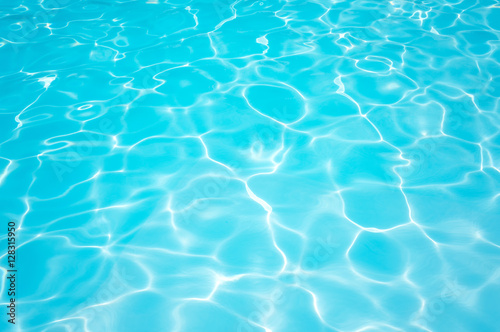 Beautiful ripple Water in swimming pool with sun reflection