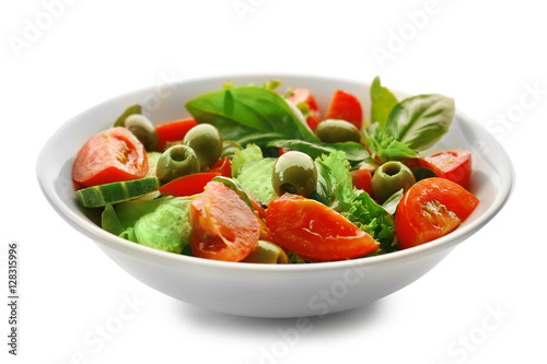 Tasty vegetable salad in plate on white background