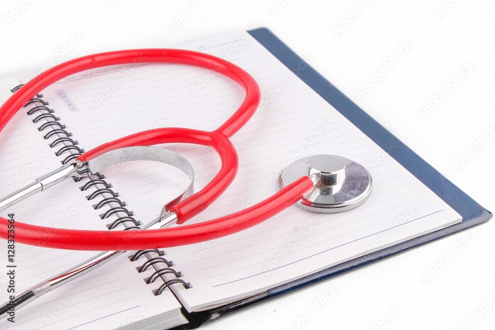 Medical concept. Stethoscope and open notebook on white background Medical concept. Stethoscope and open notebook on white background