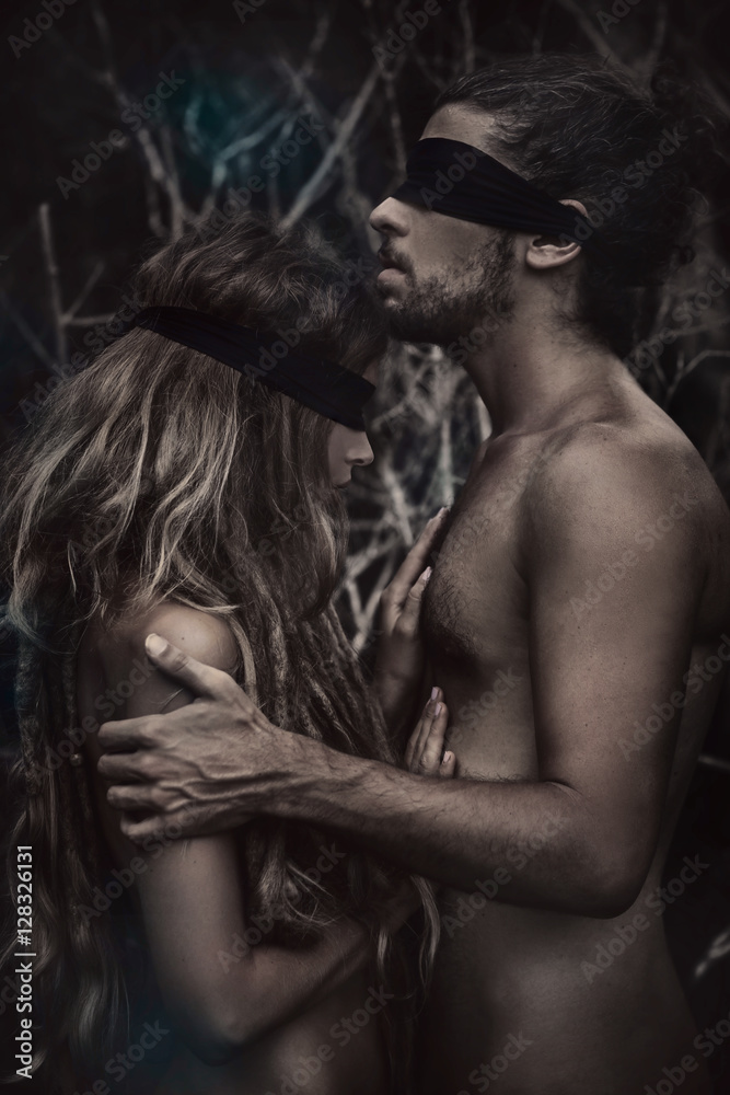 atrractive young man and woman with eyes closed. lost in forest. atrractive young man and woman with eyes closed. lost in forest.