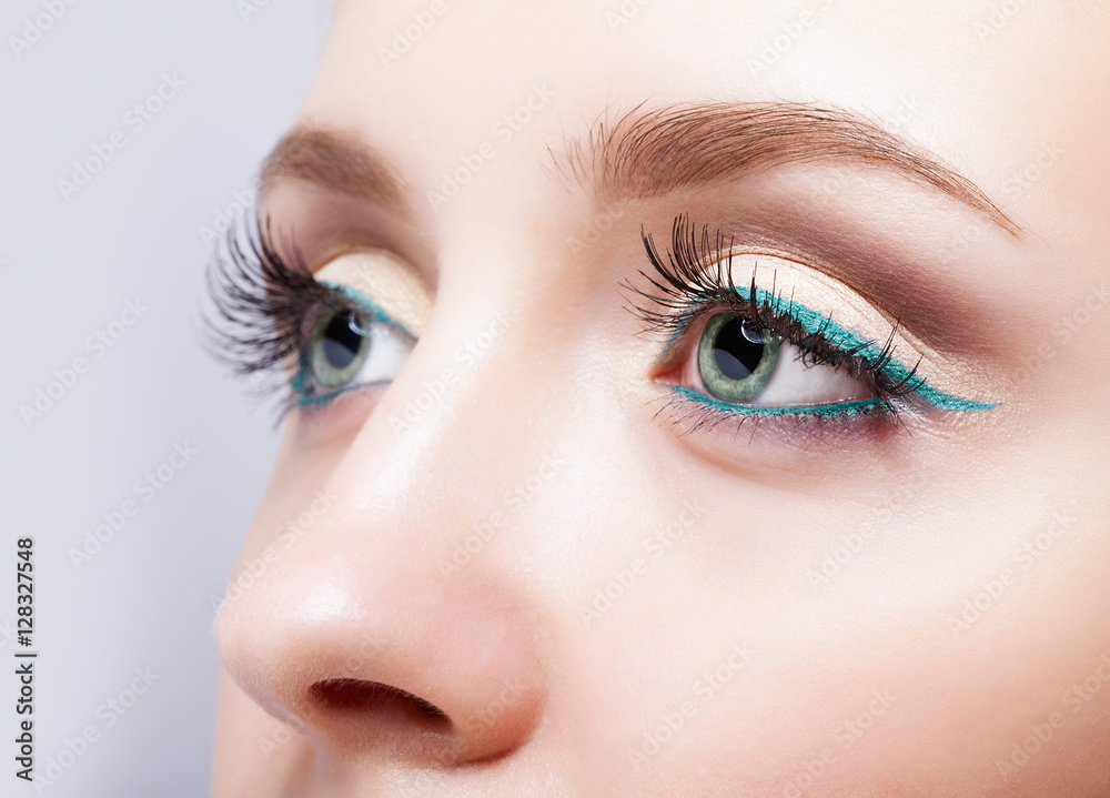 female eye zone and brows with evening green eyeliner makeup female eye zone and brows with evening green eyeliner makeup