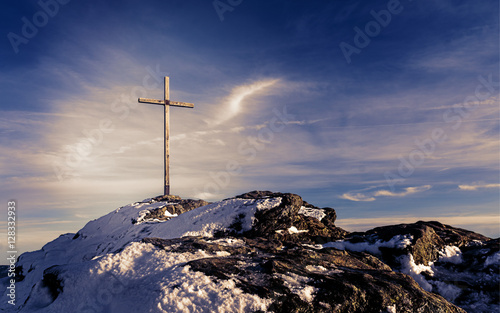 Wooden summit cross on the mountain peak with cloudy clear sky - Picture with mystic purple look © Michael Urmann