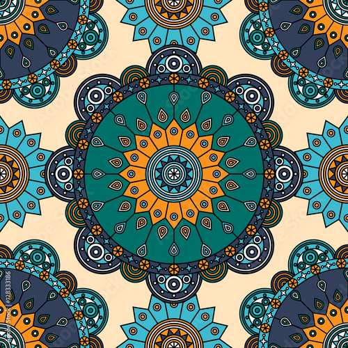 Seamless bohemian medallion pattern in teal green, shades of dark & light blue, orange & white. 