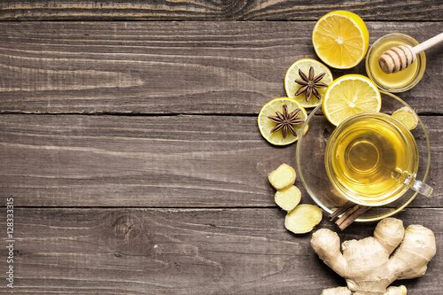 cup of ginger tea with lemon, honey and spices
