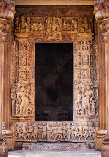 Copyspace in a frame of the portal of the ancient Indian temple, with carved bas-reliefs. photo