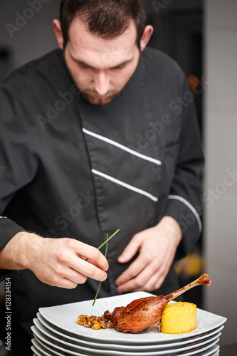 Chef is making meat dish