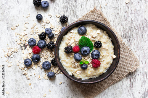 oatmeal porridge with ripe berries photo
