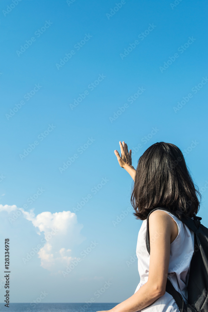 pretty asian girl relax with blue sky, freedom and travel concep pretty asian girl relax with blue sky, freedom and travel concep