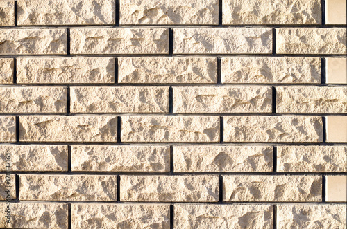 brick yellow background with a rough surface