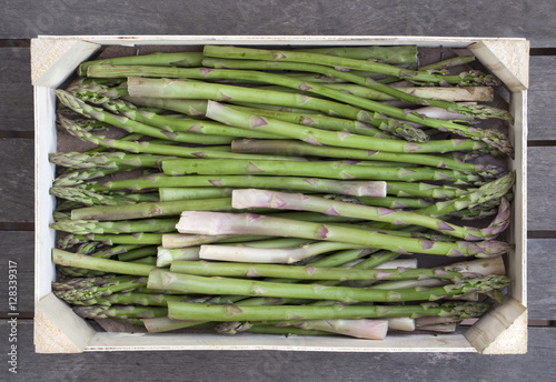 Wooden box of fresh .asparagus photo