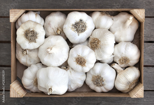Wooden box of fresh garlic